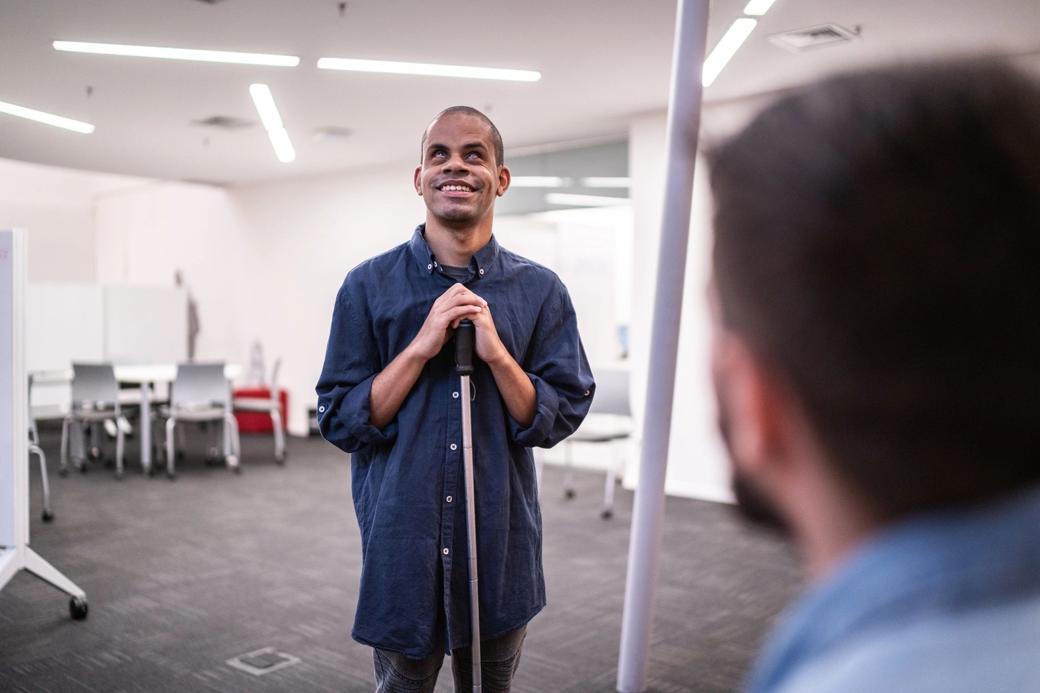 Person with vision impairment participating confidently in a learning setting